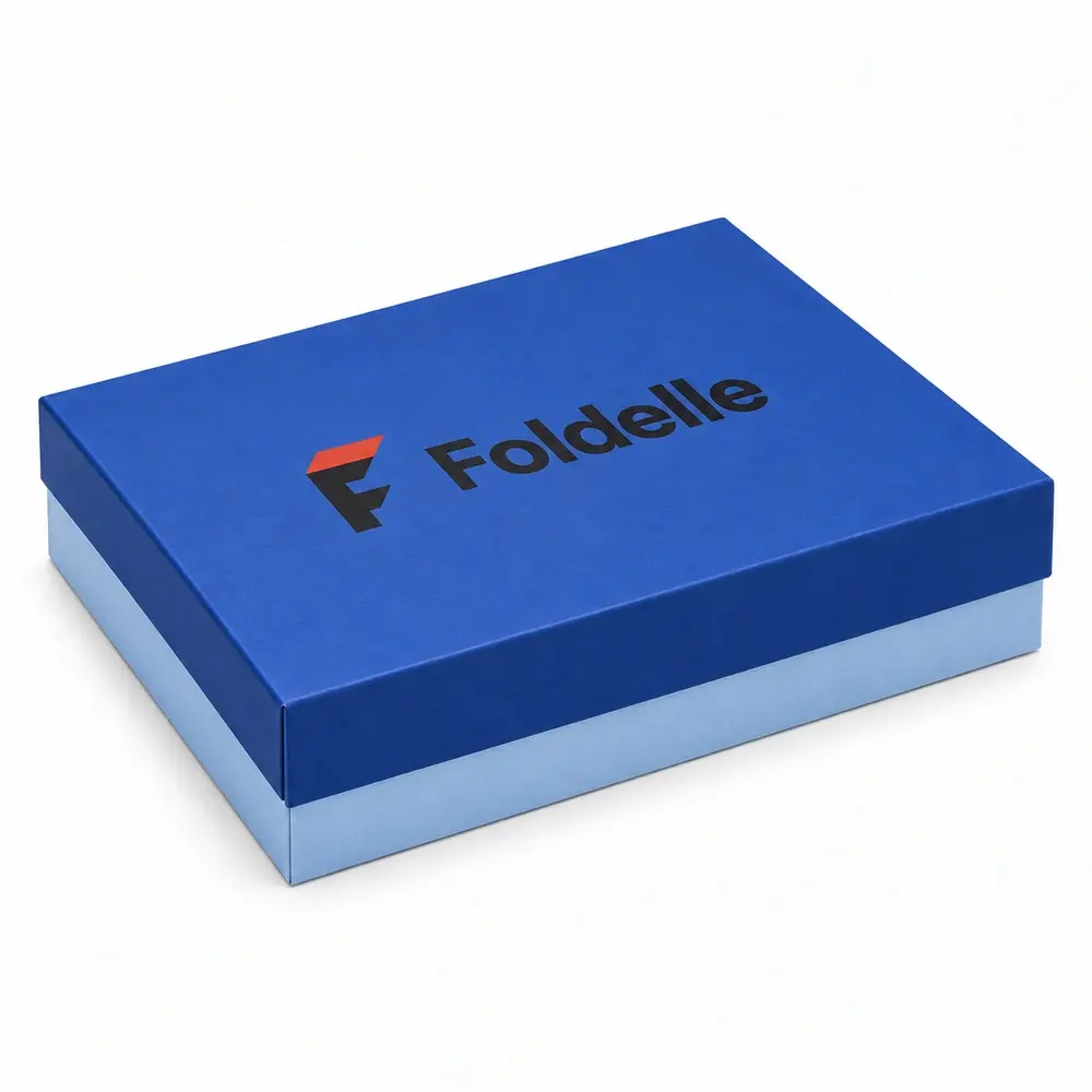 Alternate view of the cobalt blue with ice blue accents lid & base boxes with Foldelle artwork