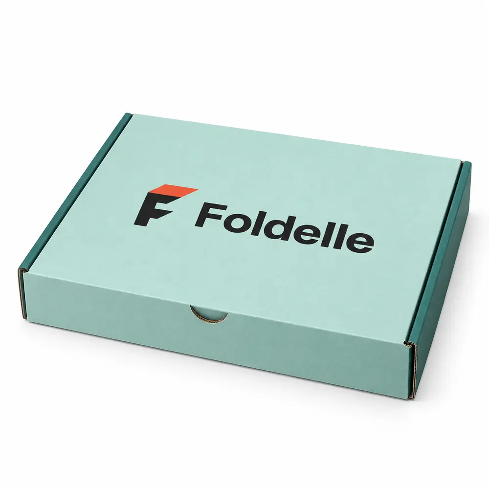 seafoam with deep teal accents tabbed subscription mailers with Foldelle logo printing on a white background