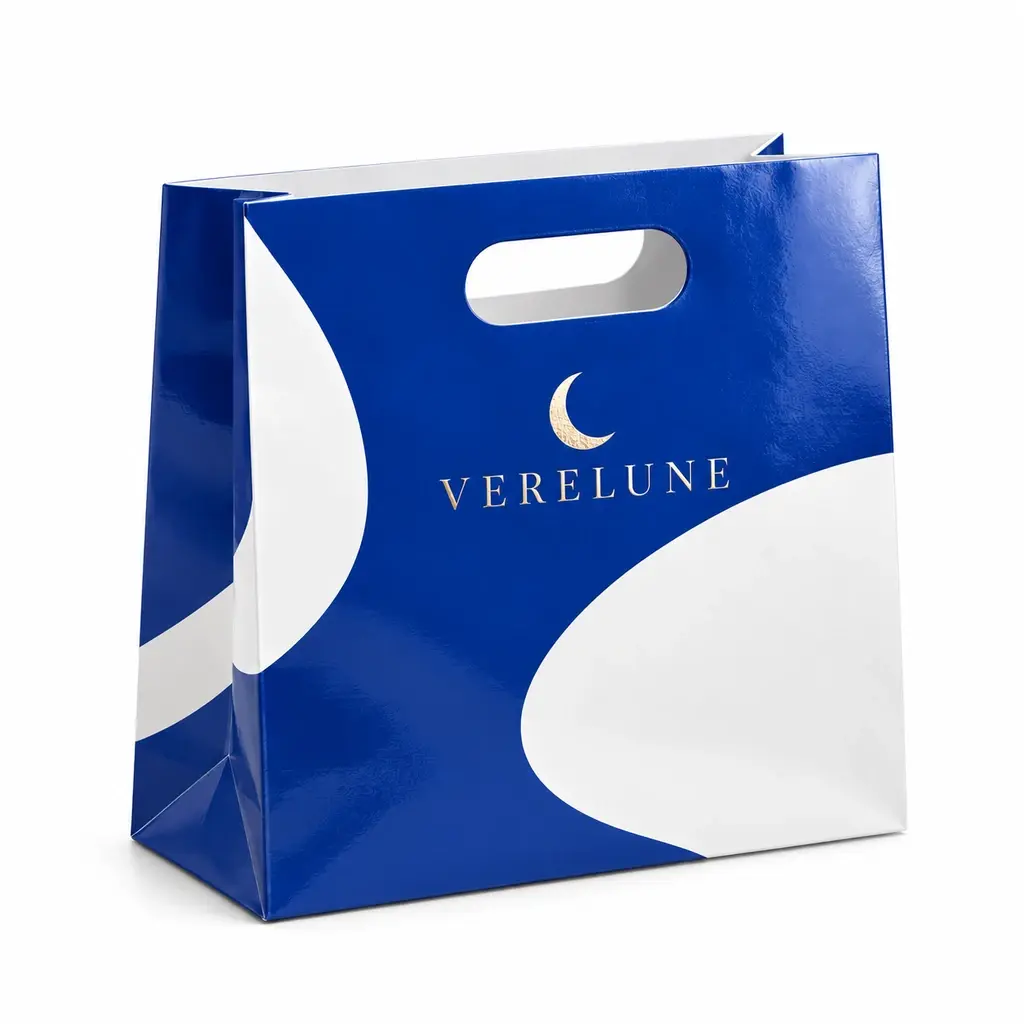 cobalt and white landscape bag with integrated oval handhold with VERELUNE logo printing on a white background