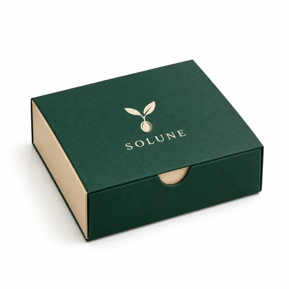 emerald with champagne accents sleeve & tray cartons with SOLUNE logo printing on a white background
