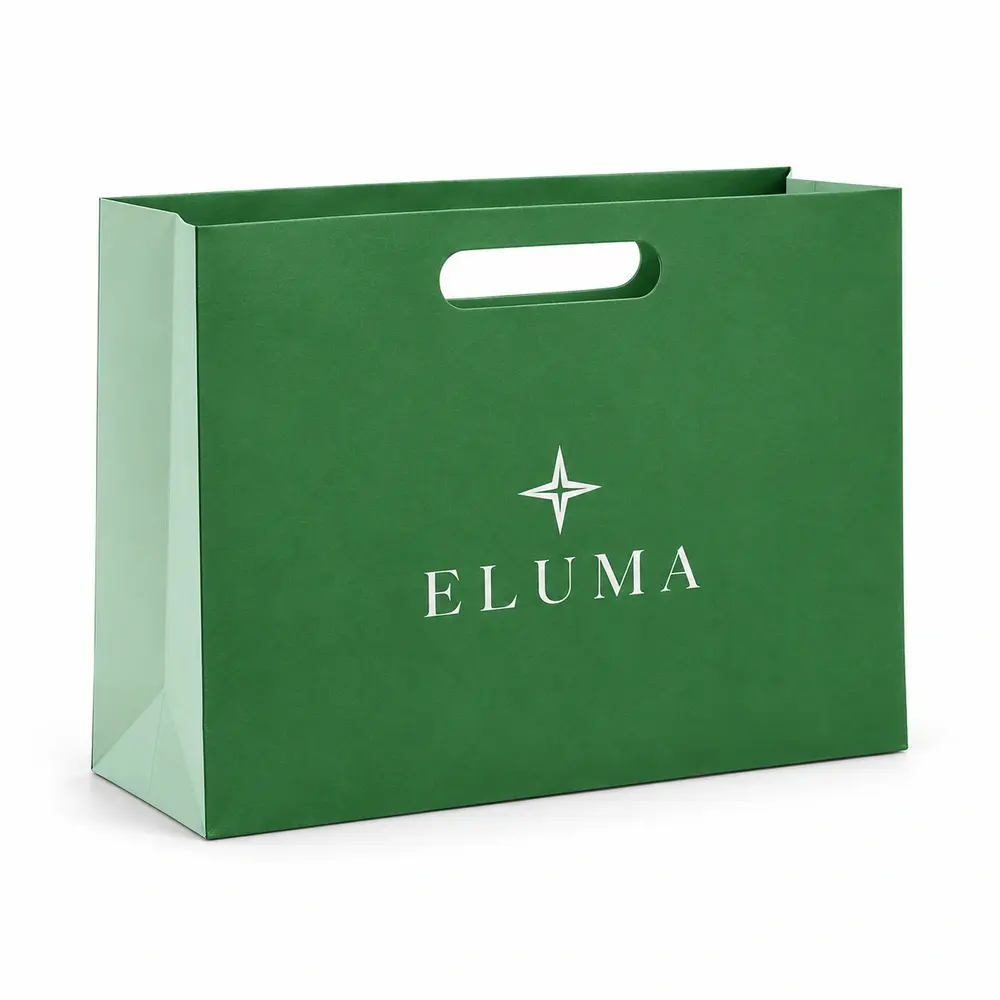 grass green with pale mint accents die-cut handle bags with ELUMA logo printing on a white background