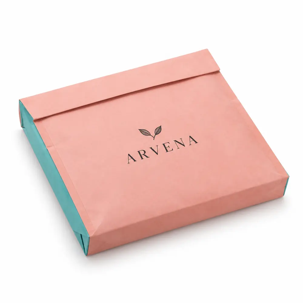 salmon pink with turquoise accents paper dispatch bags with ARVENA logo printing on a white background