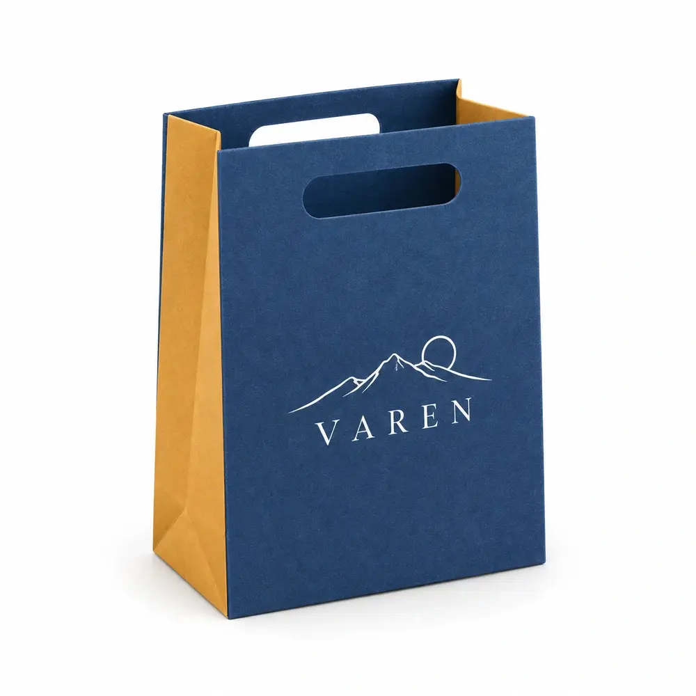 denim blue with ochre accents die-cut handle bags with VAREN logo printing on a white background