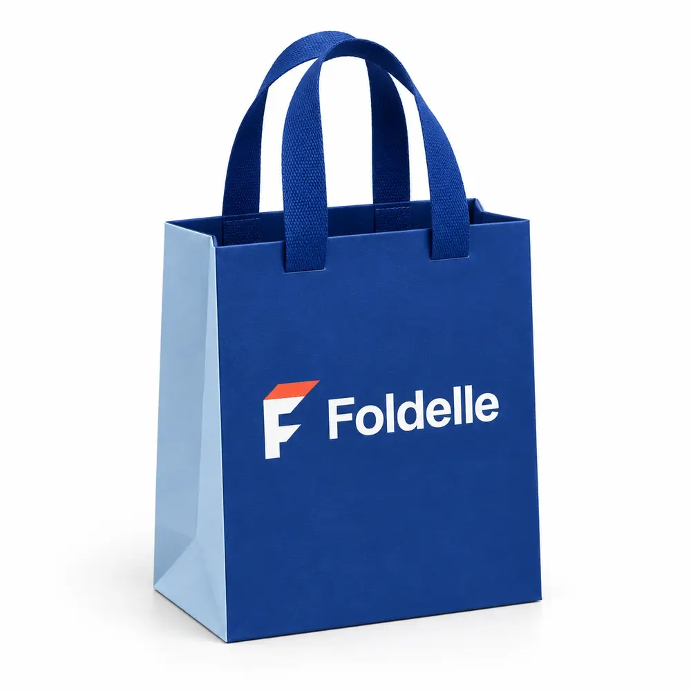 cobalt blue with ice blue accents ribbon-handle gift bags with Foldelle logo printing on a white background