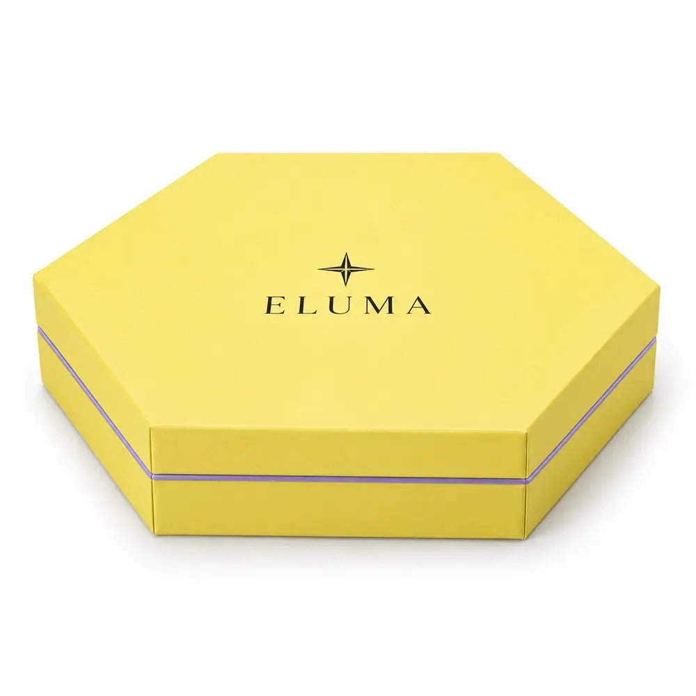 lemon yellow with lilac accents hexagonal magnetic boxes with ELUMA logo printing on a white background