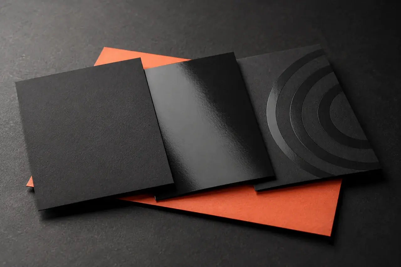 AI-generated charcoal sample cards illustrating matte, gloss and selective glossy details