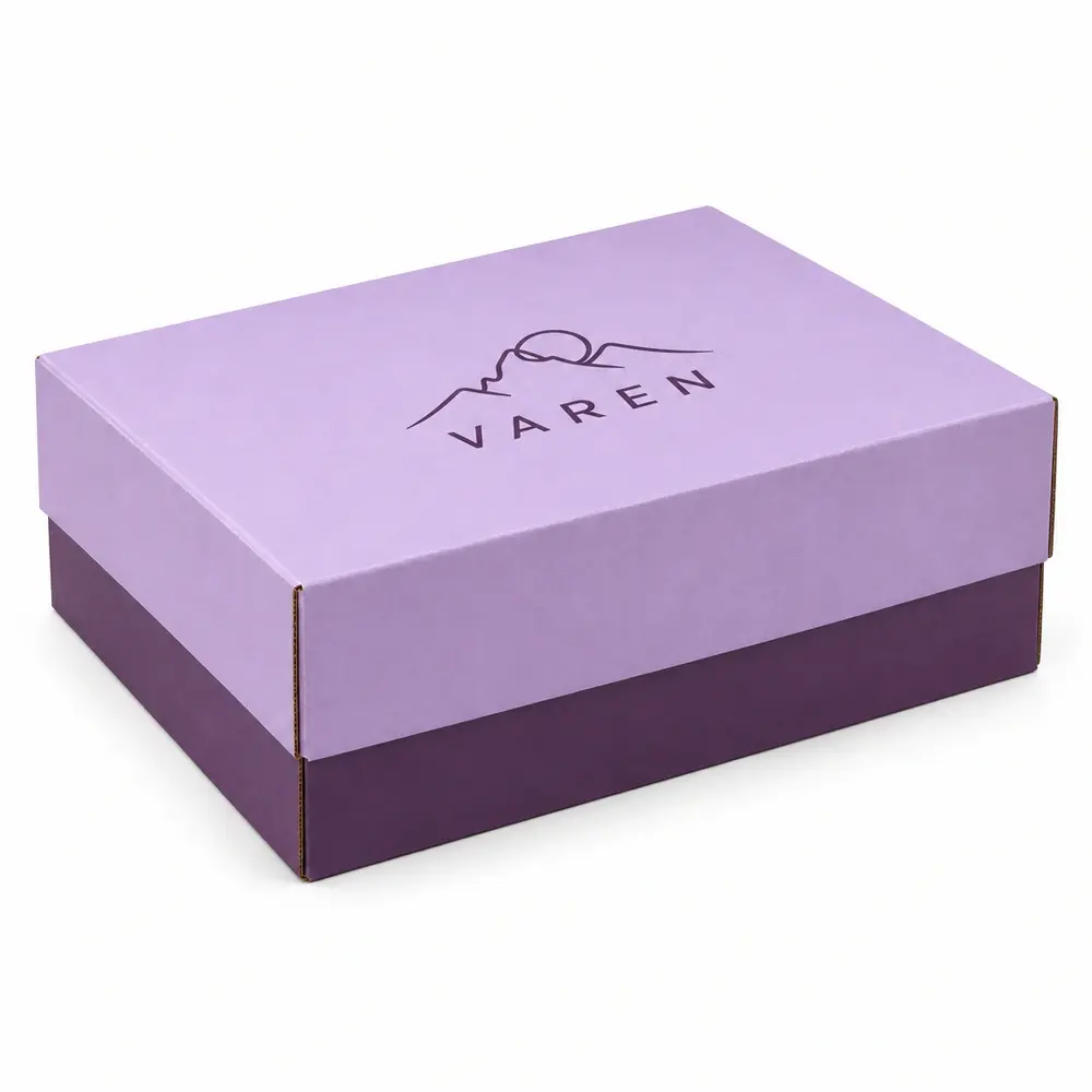 Alternate view of the powder lilac with aubergine accents telescoping shipping boxes with VAREN artwork