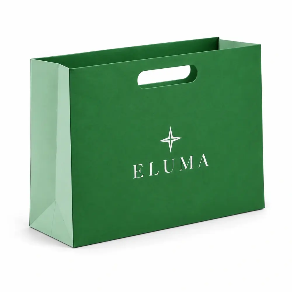 Alternate view of the grass green with pale mint accents die-cut handle bags with ELUMA artwork
