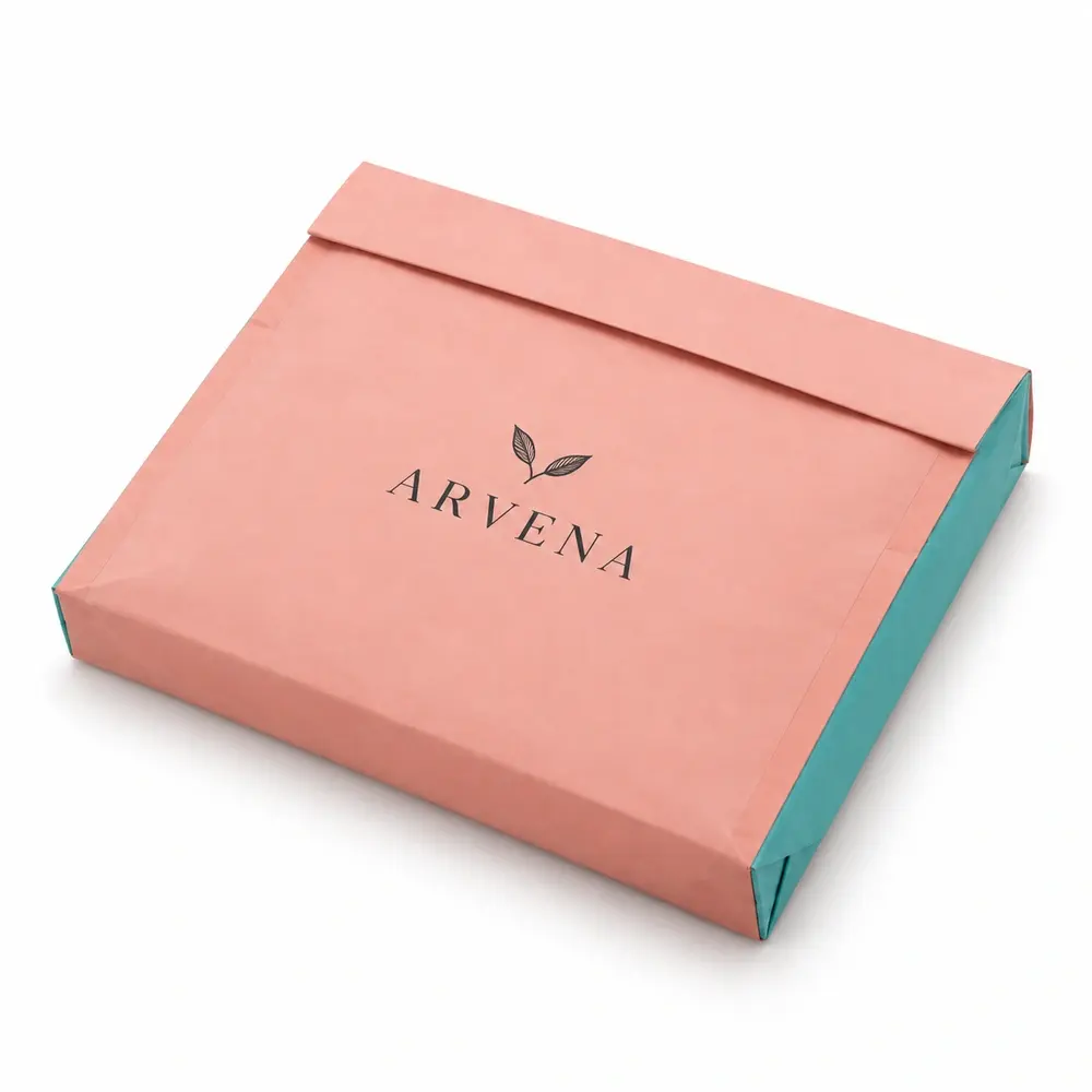 Alternate view of the salmon pink with turquoise accents paper dispatch bags with ARVENA artwork