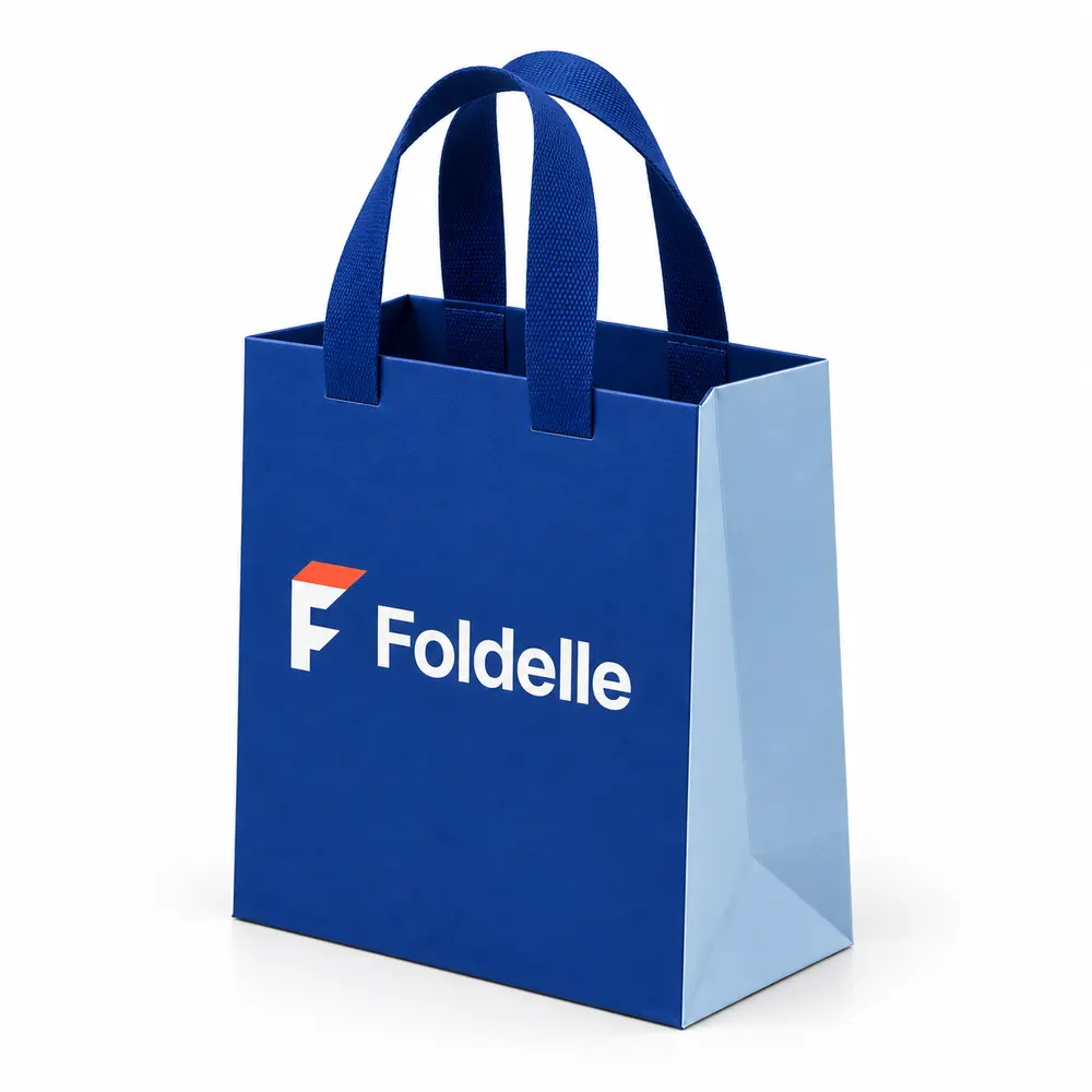 Alternate view of the cobalt blue with ice blue accents ribbon-handle gift bags with Foldelle artwork